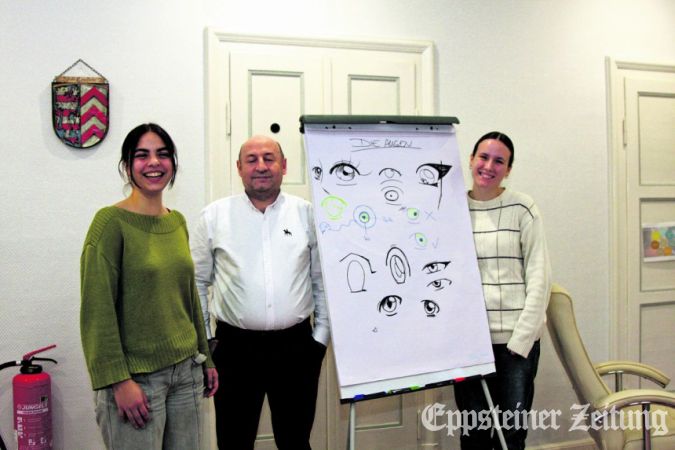 Emilia Pflüger, Engin Kaldirim und Amy Mahlow – das neue Team der städtischen Jugendarbeit vor dem Relikt eines Ferien-Manga-Malkurses.Foto: bpa
